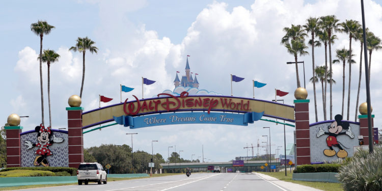 In fear of the protests: He showed up with an AR-15 and a gun… at Disney World!